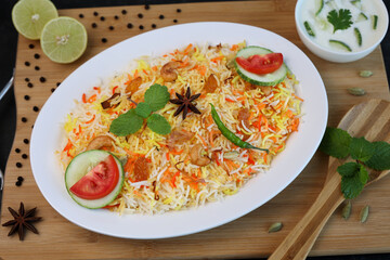 Vegetable biryani biriyani ,  Hyderabadi Shahi Pulao and raita Pilaf Basmati rice dish Indian spices Kerala India Sri Lanka Pakistan. Ghee rice, Lemon rice, boiled white rice
