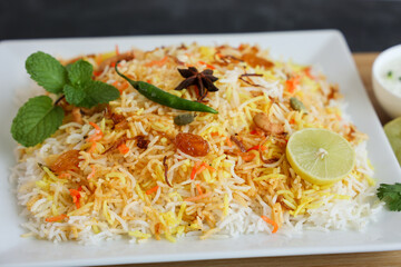 Vegetable biryani biriyani ,  Hyderabadi Shahi Pulao and raita Pilaf Basmati rice dish Indian spices Kerala India Sri Lanka Pakistan. Ghee rice, Lemon rice, boiled white rice