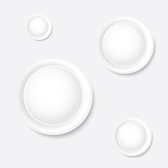 Circle white button with a symbol on gray background.