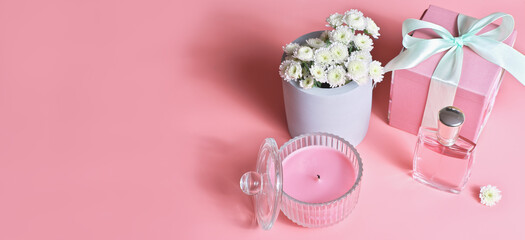 female gift set in pink color, perfume bottle, soy scented candle