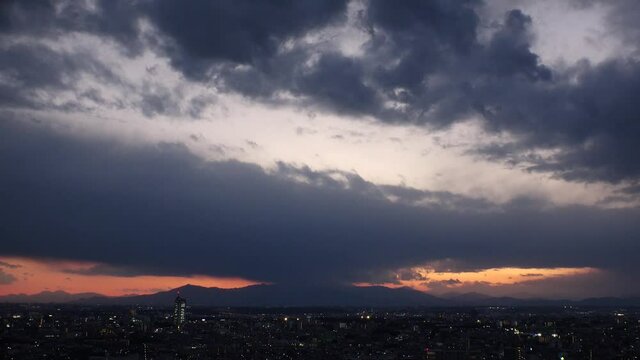 TOKYO, JAPAN : Aerial sunrise CITYSCAPE of TOKYO. View of dramatic dawn sky, clouds and rising sun. Japanese urban city life and nature concept. Long time lapse video, night to fresh early morning.