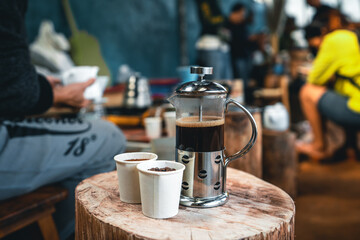Coffee Cup And French Press On wood Table