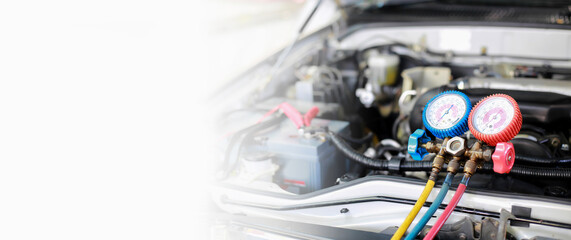 Fototapeta premium Car air conditioner check service, leak detection, fill refrigerant.Device and meter liquid cooling in the car by specialist technicians.