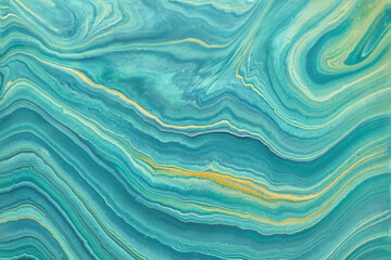 Abstract fluid art background blue and golden glitter colors. Liquid marble.