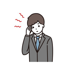 頭痛に悩むスーツ姿の若い男性