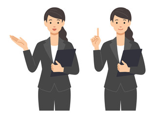 スーツを着て案内している若い女性スタッフ