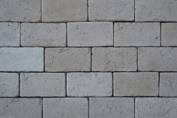 Brickwork from gray, large bricks close-up, outside.
