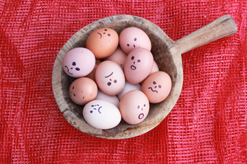 Eggs Faces, drawnigs on eggs. selective focus, a broken and unhappy staring egg and others.Close up...