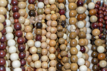 Wooden beads. Round beads of various colors and textures. Selective focus.