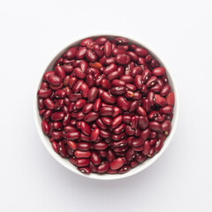 Close up of Organic Rajma,  (Laal Lobia ) or red kidney beans dal on a ceramic white bowl. Top view 