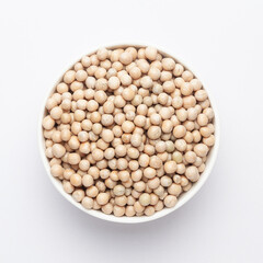 Close up of Organic dry peas whole  (Pisum sativum) or matar dal in a ceramic white bowl. Top view 