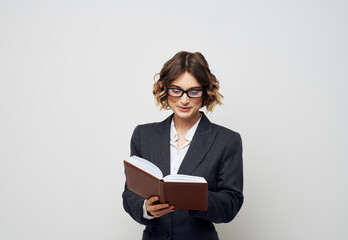 Business woman books documents model suit hairstyle glasses