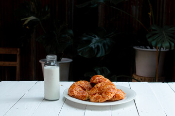 Croissant on wooden tabel background