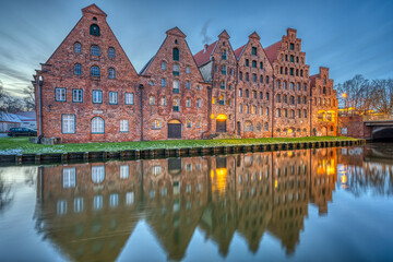 The historic Salzspeicher with the Trave river at dawn, seen in Luebeck, Germany