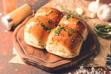 Fresh bread with garlic on grunge background