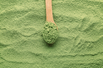 Spoon and powdered matcha tea, closeup