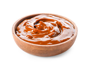 Bowl of boiled condensed milk on white background