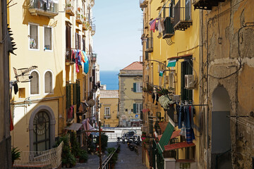 Naples steep narrow street with balconies with fresh linen, traditional living in Naples, Italy © Milan