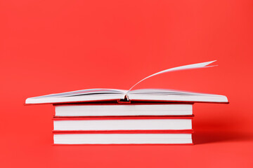 Blank books on color background