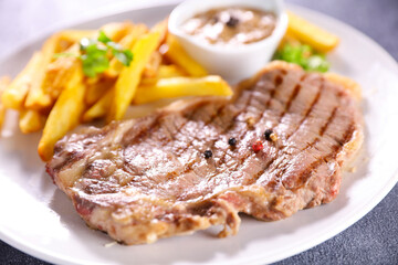 grilled beef steak and french fries