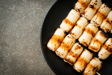 grilled tube shaped fish paste cake skewe or tube squid skewer