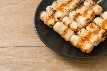 grilled tube shaped fish paste cake skewe or tube squid skewer