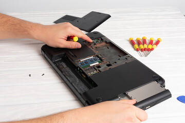 Disassembled notebook on white background.