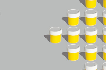 Arrow pattern Cans of yellow gouache paint on the ultimate gray background in color 2021 copy space