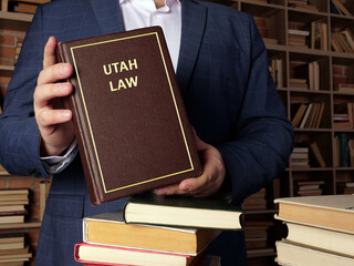  UTAH LAW book in the hands of a attorney. The state constitution is the framework for Utah...