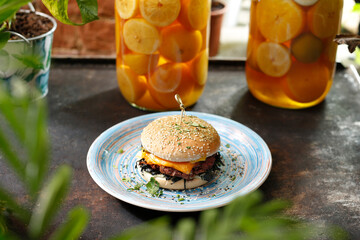  Vegetarian burger with chedar cheese. Culinary photo of food.