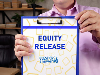 Business concept about EQUITY RELEASE with sign on the page.
