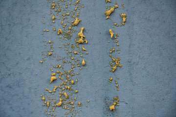 Background in the form of a gray wall with the remains of polyurethane foam - obrazy, fototapety, plakaty