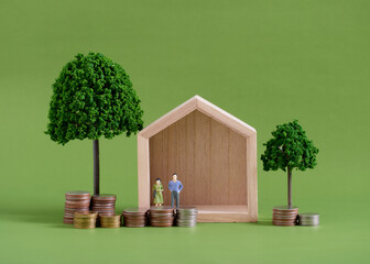 Model house with people and coins