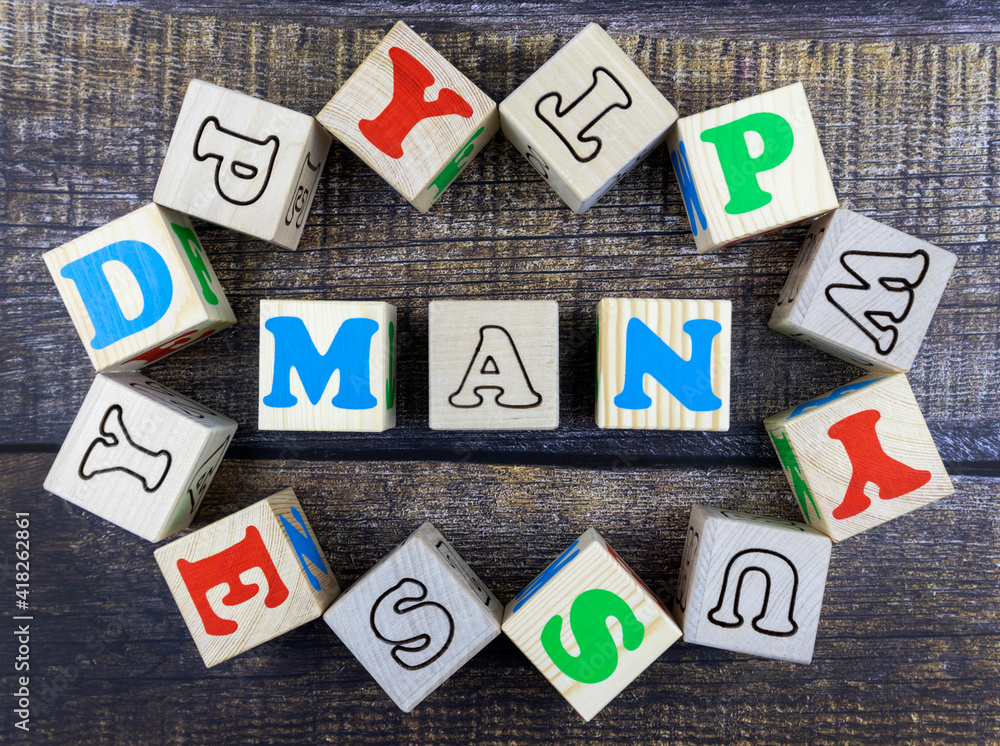 Poster word - man - in colorful alphabet letters on wooden cubes surrounded by a frame of additional random