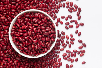 Close up of Organic Rajma,  (Laal Lobia ) on a ceramic white bowl with the gradient background of red kidney beans dal. Top view 