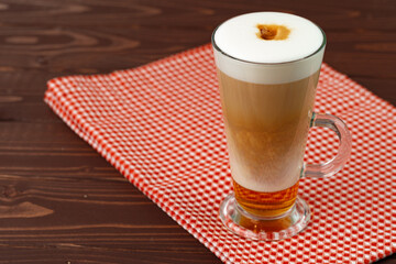 Cup of hot coffee latte on table