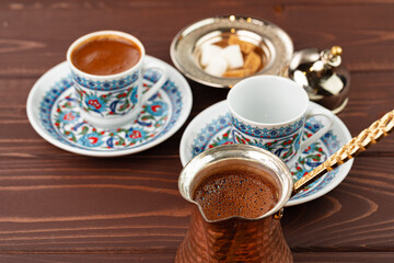 Traditional turkish coffee in oriental dishware close up