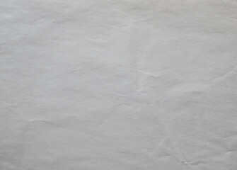 Crumpled off white paper texture background.