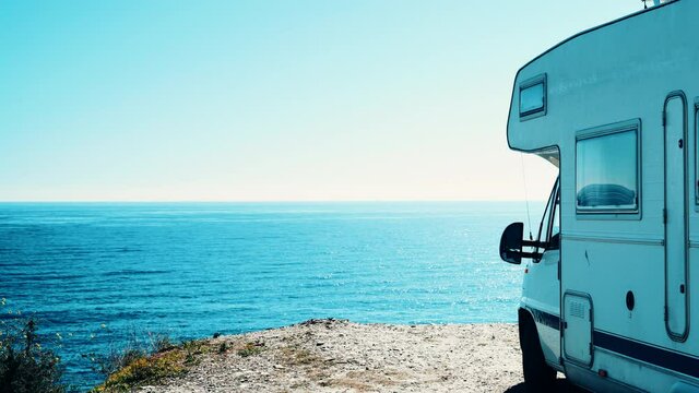 Camper rv camping on sea shore, Almeria province, Andalusia Spain. Traveling by motor home. Caravan vacation.