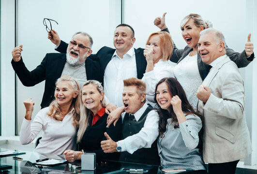 group of happy business people showing thumbs up