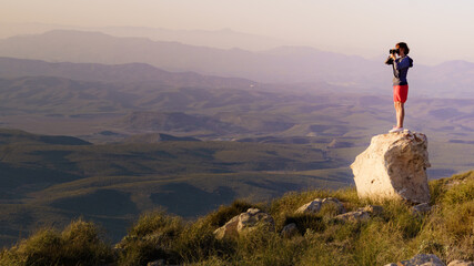 Woman with camera take travel photo