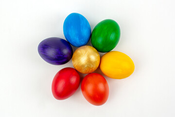 Multicolored eggs on white background