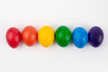 Multicolored eggs on white background