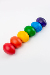 Multicolored eggs on white background