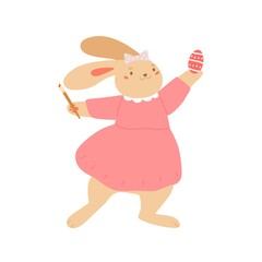 Cute bunny holding brush and painting egg for Easter. Funny baby rabbit standing in dress. Colored flat vector illustration isolated on white background