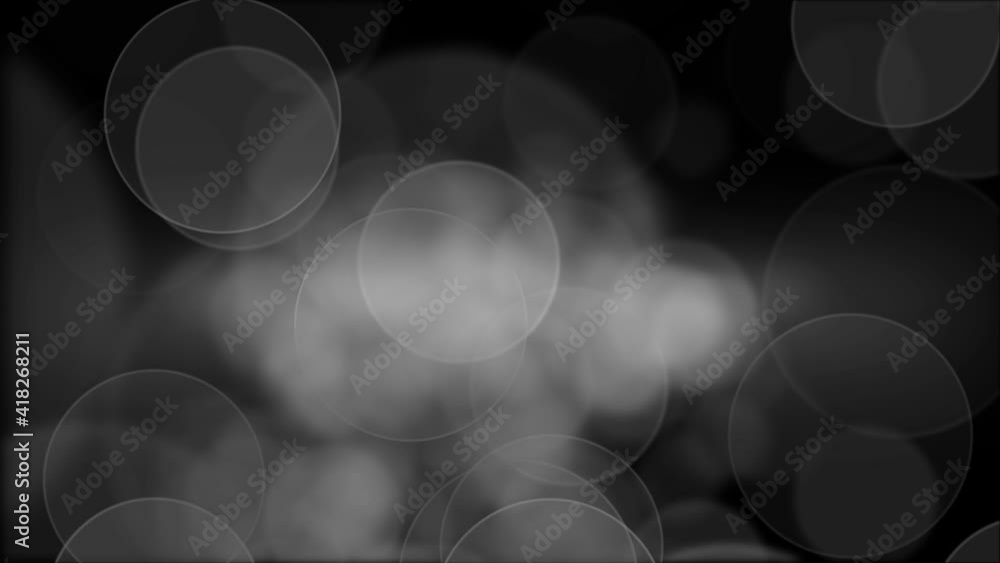 Poster abstract circular bokeh black and white background of christmas light animation. abstract blurred wh