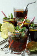 Glasses of Cuba Libre on white textured table