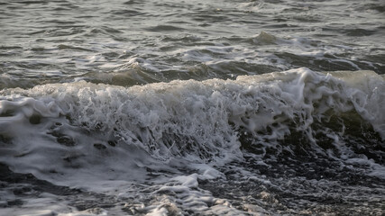 Sea wave close-up. Sea foam.