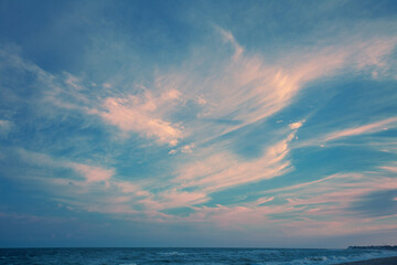 Fototapeta na wymiar Beautiful flaming dramatic sky above the sea during sunrise. Seascape in the early morning