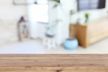 Wooden empty table in front of Living room interior. For product display and presentation
